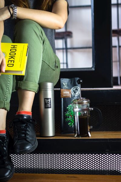 girl with coffee and books